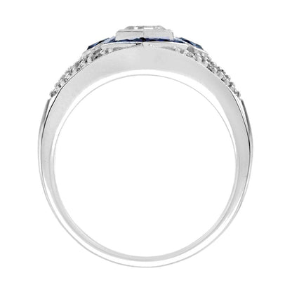 Unique Hexagonal Diamond and Sapphire Cluster Dress Ring, 0.45ct hexagonal-cut diamond surrounded by calibre French-cut sapphires on diamond-studded 18ct white gold mount