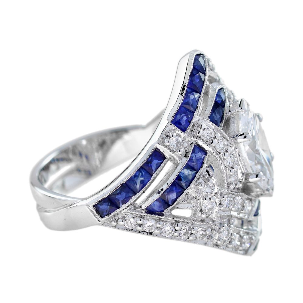 GIA 1ct Marquise Diamond and Sapphire Cluster Dress Ring, D Colour Internally Flawless, GIA Certified D IF 1ct marquise-cut diamond centrally set to tapered navette surround studded with sparkling diamonds accented with lines of French cut blue sapphires in 18ct white gold with a GIA certificate