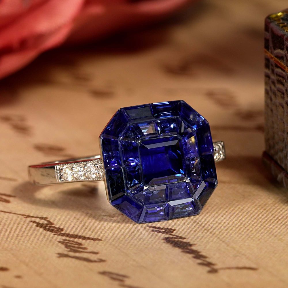 Octagonal Sapphire Cluster Solitaire Engagement Ring, 5.72cts multi asscher and calibre cut sapphires arranged in invisible setting to produce an octagonal shaped design