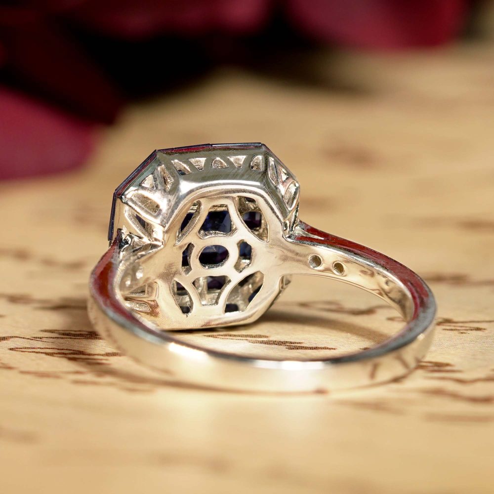 Octagonal Sapphire Cluster Solitaire Engagement Ring, 5.72cts multi asscher and calibre cut sapphires arranged in invisible setting to produce an octagonal shaped design