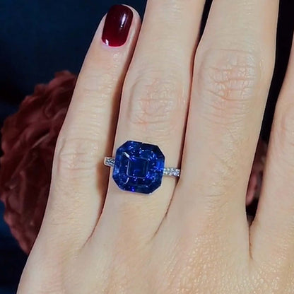 Octagonal Sapphire Cluster Solitaire Engagement Ring, 5.72cts multi asscher and calibre cut sapphires arranged in invisible setting to produce an octagonal shaped design