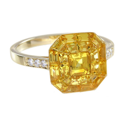Yellow Sapphire Octagonal Cluster Solitaire Engagement Ring, 5.27cts yellow sapphires arranged in an invisible setting to produce an octagonal shaped design in 14ct yellow gold with diamond set shoulders