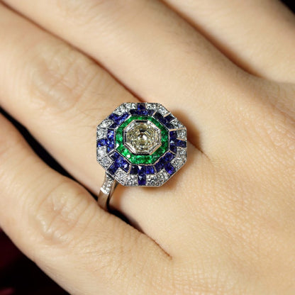 Asscher Cut Diamond Emerald Sapphire Octagonal Cluster Ring,l 1.01ct asscher-cut diamond surrounded by multiple borders of emeralds, sapphires and diamonds in 18ct white gold