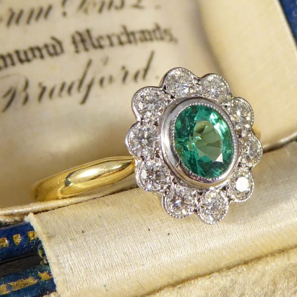 0.50ct Oval Cut Emerald and Diamond Cluster Ring