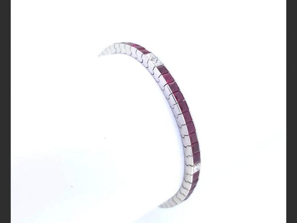 Ruby and Diamond Line Bracelet, set with French cut rubies and princess cut diamonds. in 18ct white gold (rubies totaling 7.00ct, diamonds totaling 0.80ct)