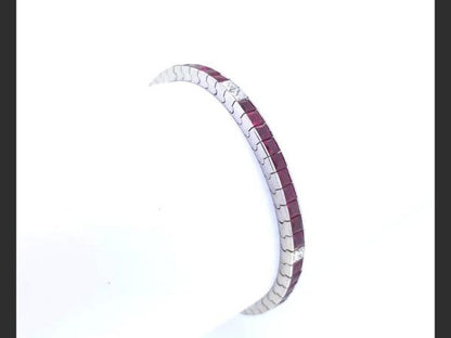 Ruby and Diamond Line Bracelet, set with French cut rubies and princess cut diamonds. in 18ct white gold (rubies totaling 7.00ct, diamonds totaling 0.80ct)