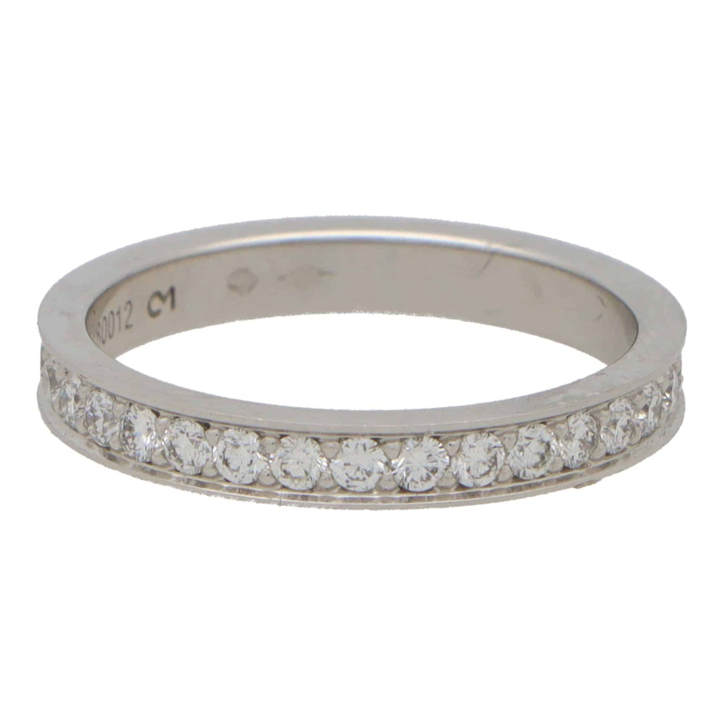 A platinum diamond full eternity band ring, on a white background