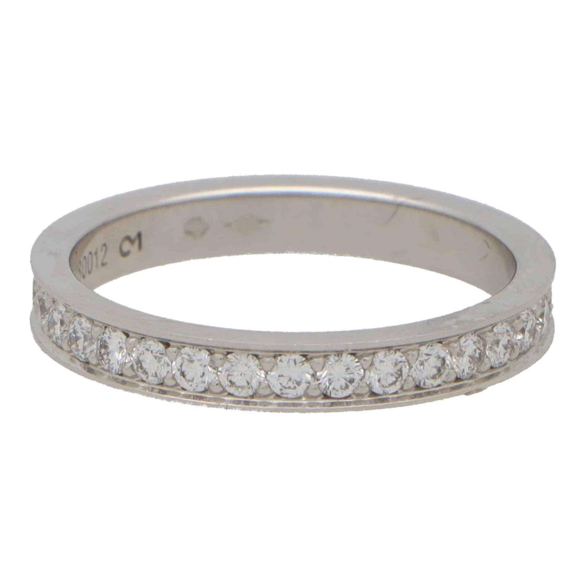 A platinum diamond full eternity band ring, on a white background
