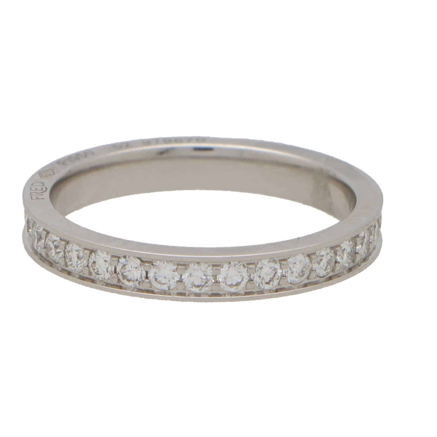 A white metal diamond set full eternity band ring, on a white background