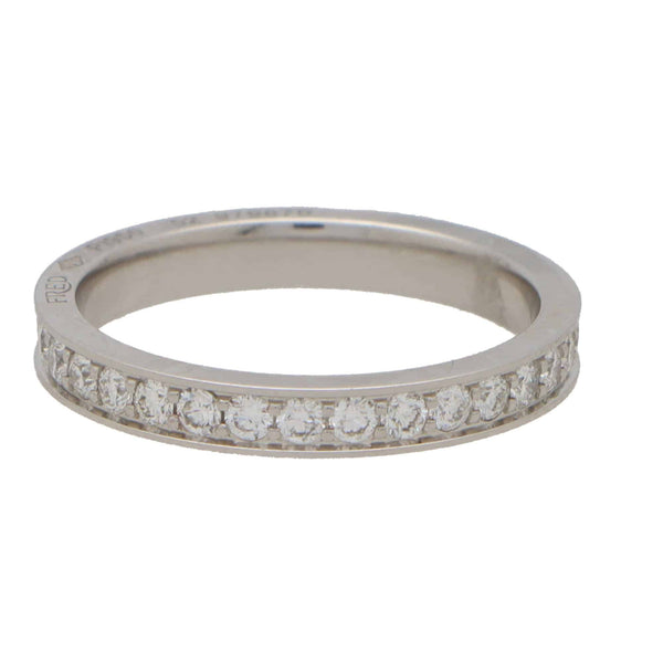 A white metal diamond set full eternity band ring, on a white background