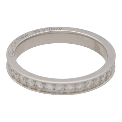 A white metal diamond set full eternity band ring stamped FRED Pt950 52 979870, on a white background