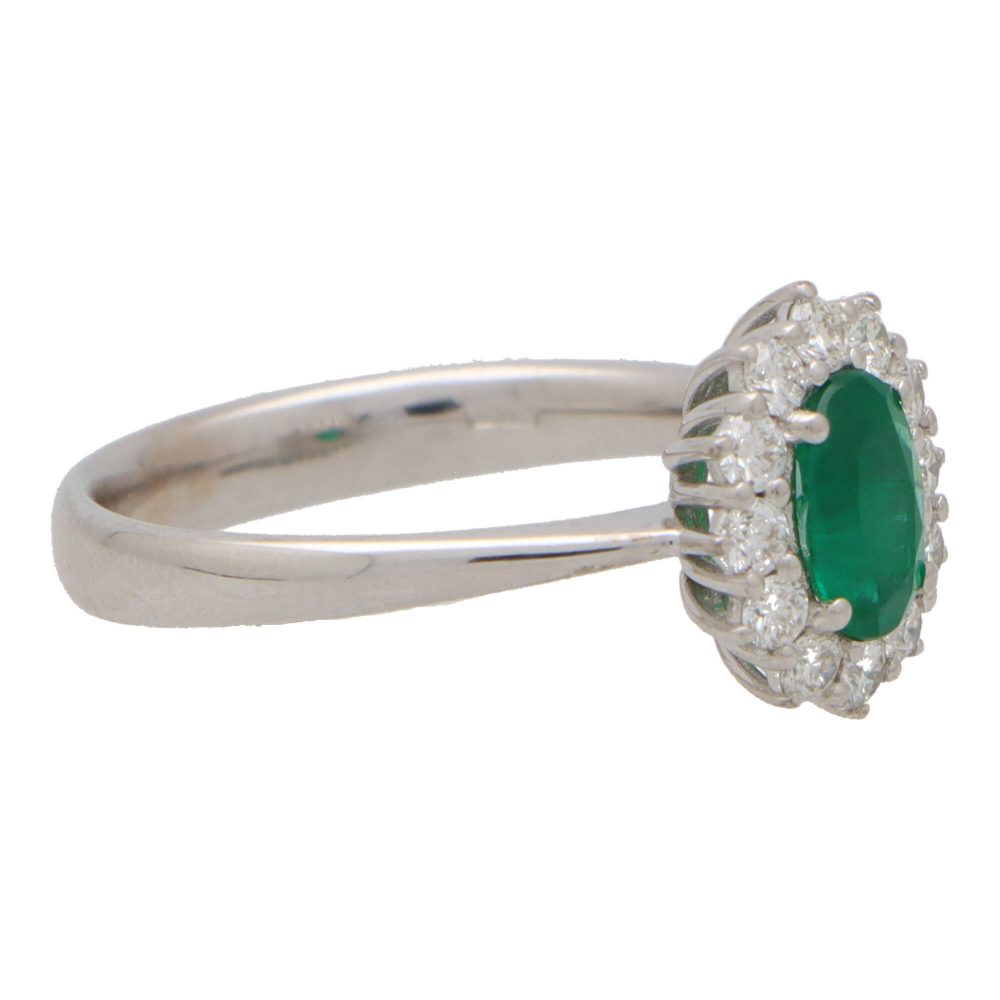 Contemporary 0.58ct Emerald and Diamond Cluster Ring