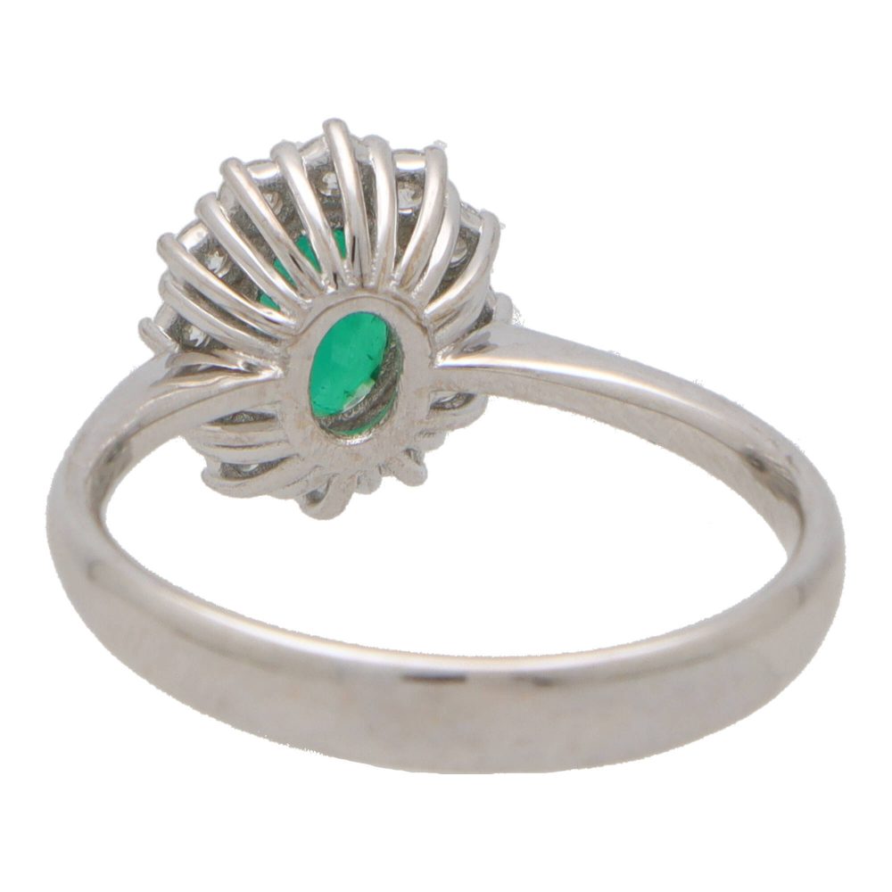 Contemporary 0.58ct Emerald and Diamond Cluster Ring