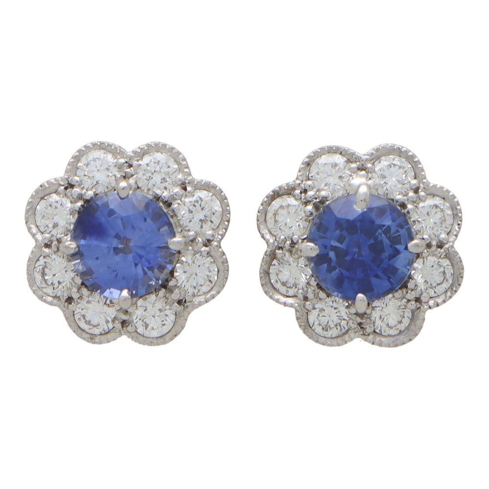 Sapphire and diamond floral cluster earrings in white and yellow gold.