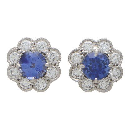 Sapphire and diamond floral cluster earrings in white and yellow gold.