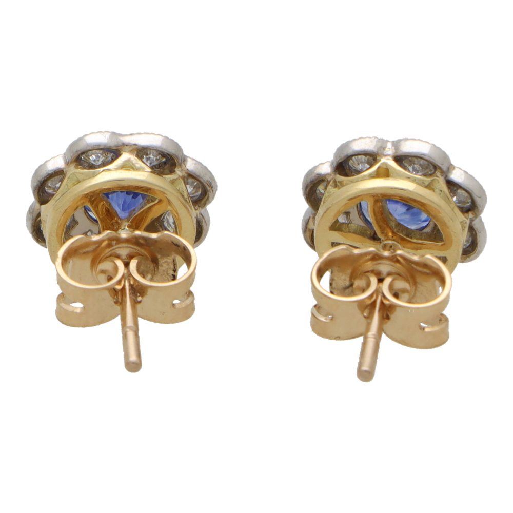 Sapphire and diamond floral cluster earrings in white and yellow gold.
