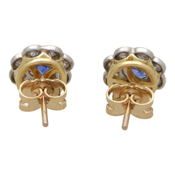 Sapphire and diamond floral cluster earrings in white and yellow gold.