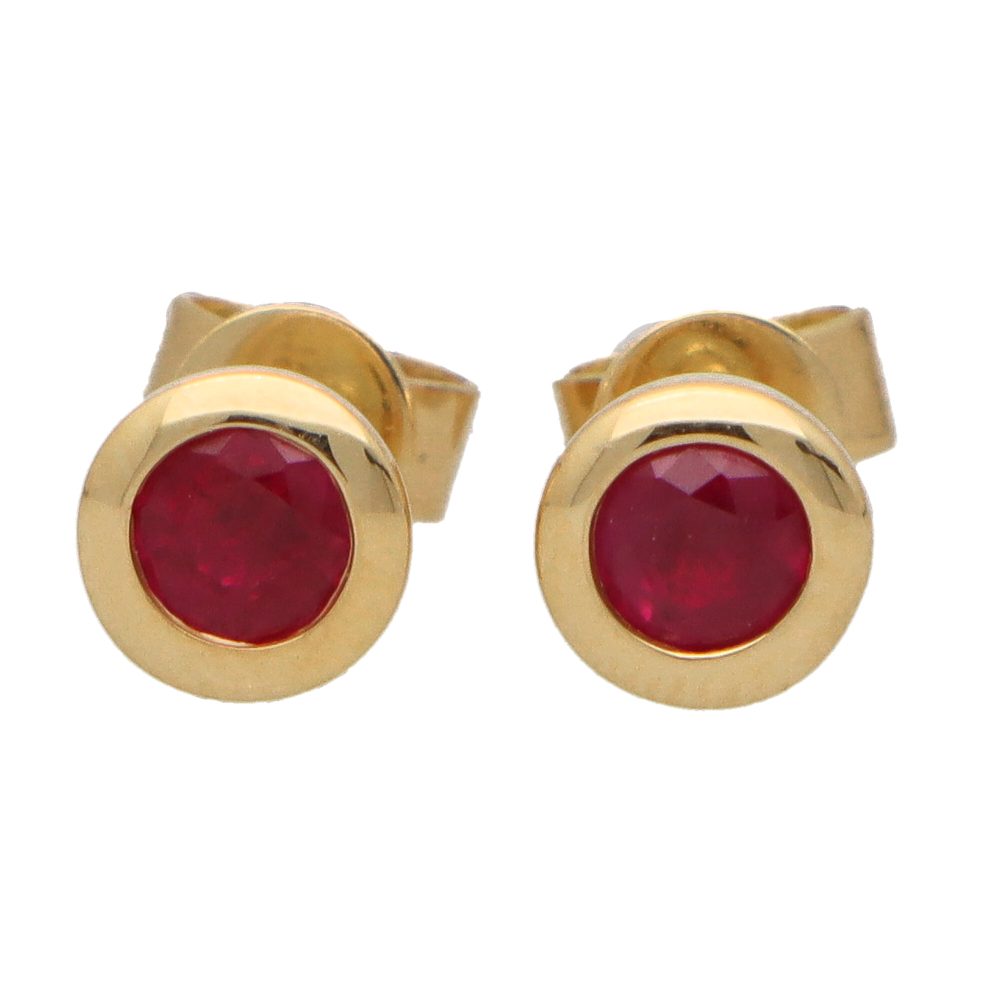 Ruby stud earrings set in 18 carat yellow gold.