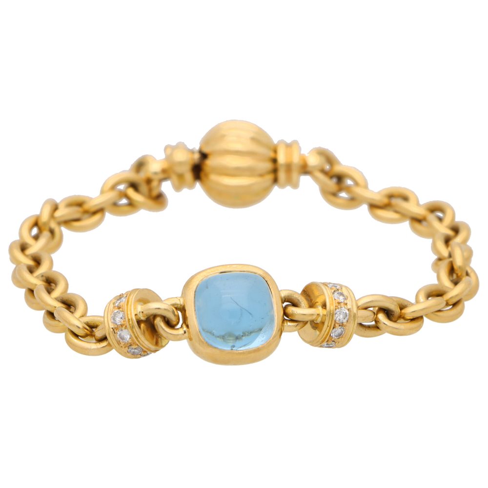 Vintage Blue Topaz and Diamond Heavy Link Gold Bracelet; 18ct yellow gold heavy solid oval link polish gold chain bracelet centrally set with a blue topaz accented either side by a diamond set link
