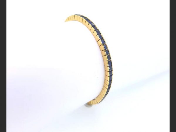 Sapphire Line Bracelet; Princess cut sapphires channel set in 18ct yellow gold. An elegant and timeless piece of jewellery