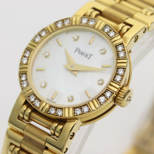 Piaget Diamond Dancer Watch in 18K Yellow Gold. Ladies' Mother of pearl dial with diamond hour markers. and diamond set bezel. With Box. Quartz