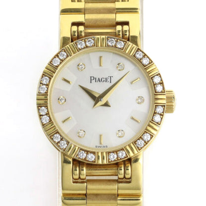Piaget Diamond Dancer Watch in 18K Yellow Gold. Mother of pearl dial with diamond hour markers. and diamond set bezel. With Box. Quartz