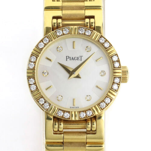 Piaget Diamond Dancer Watch in 18K Yellow Gold. Mother of pearl dial with diamond hour markers. and diamond set bezel. With Box. Quartz