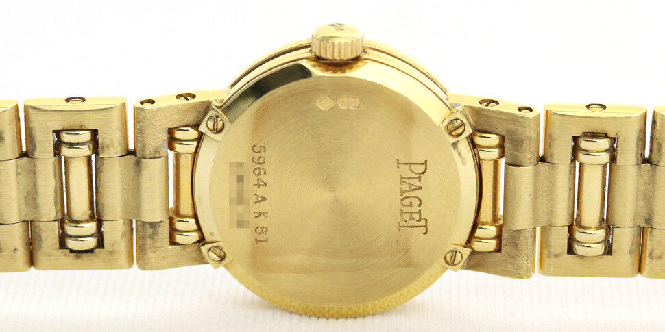 Piaget Diamond Dancer Watch in 18K Yellow Gold. Mother of pearl dial with diamond hour markers. and diamond set bezel. With Box. Quartz