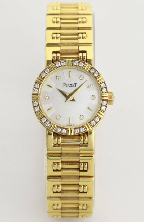 Ladies' Piaget Diamond Dancer Watch in 18K Yellow Gold. Mother of pearl dial with diamond hour markers. and diamond set bezel. With Box. Quartz