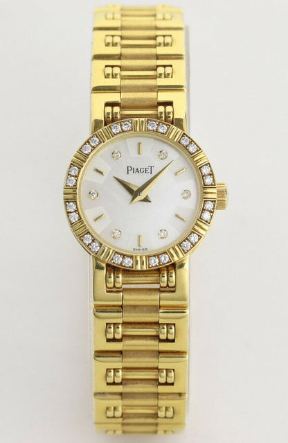 Ladies' Piaget Diamond Dancer Watch in 18K Yellow Gold. Mother of pearl dial with diamond hour markers. and diamond set bezel. With Box. Quartz