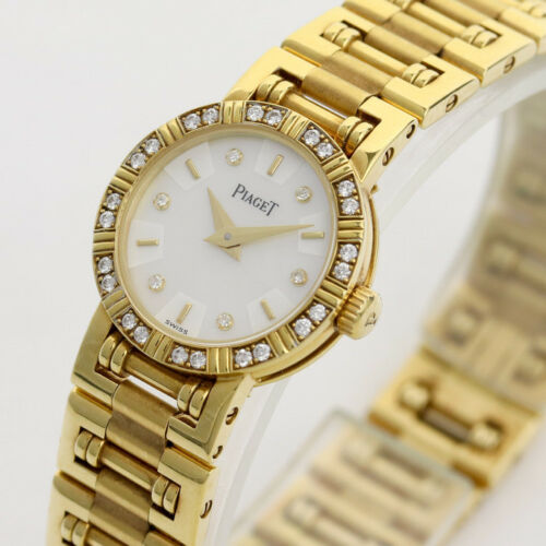 Piaget Diamond Dancer Watch in 18K Yellow Gold. Ladies' Mother of pearl dial with diamond hour markers. and diamond set bezel. With Box. Quartz
