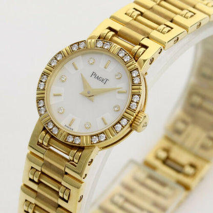 Piaget Diamond Dancer Watch in 18K Yellow Gold. Ladies' Mother of pearl dial with diamond hour markers. and diamond set bezel. With Box. Quartz
