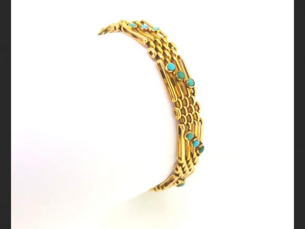 alternating gate bar and cluster links, each gate link set with a trio of cabochon turquoises,15ct yellow gold