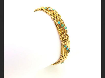 alternating gate bar and cluster links, each gate link set with a trio of cabochon turquoises,15ct yellow gold