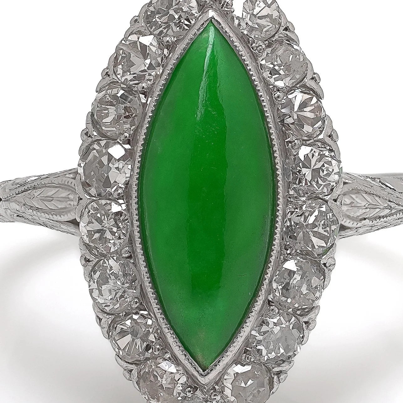 A jade and diamond navette shaped cluster ring in platinum
