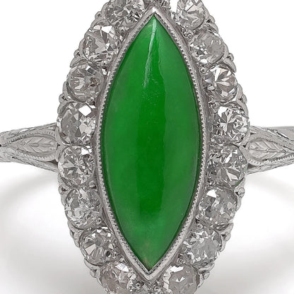 A jade and diamond navette shaped cluster ring in platinum