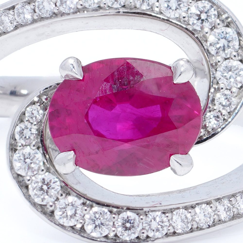 Vintage 1.20ct Ruby and Diamond Dress Ring, central 1.20ct oval red ruby surrounded by dynamic curve with pavé-set diamonds in platinum. Circa 1990s