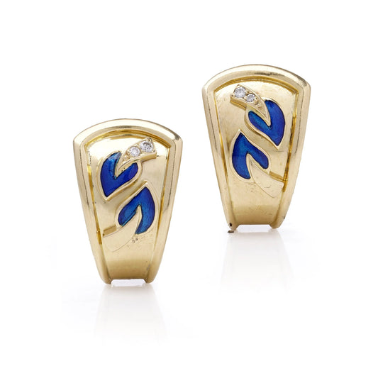 A pair of yellow gold earrings with blue enamel leaves and round diamonds, on a white background