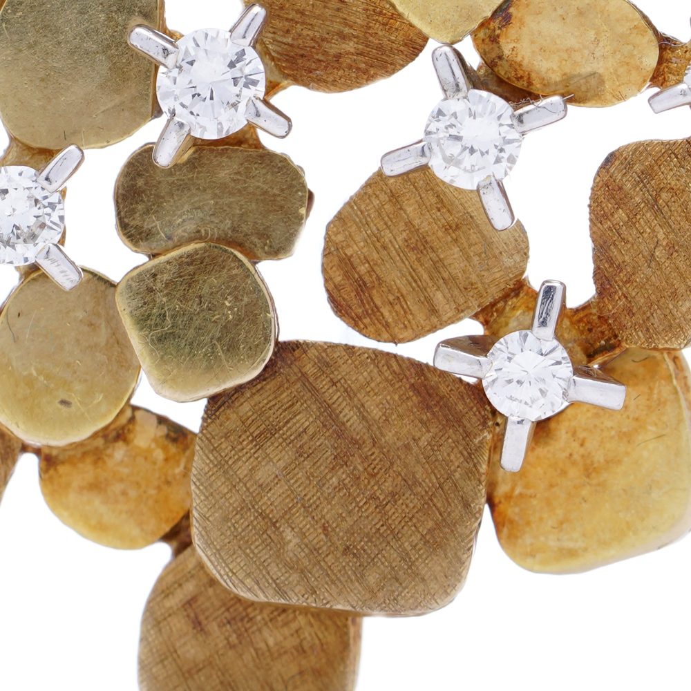 Vintage gold textured petal design diamond brooch.