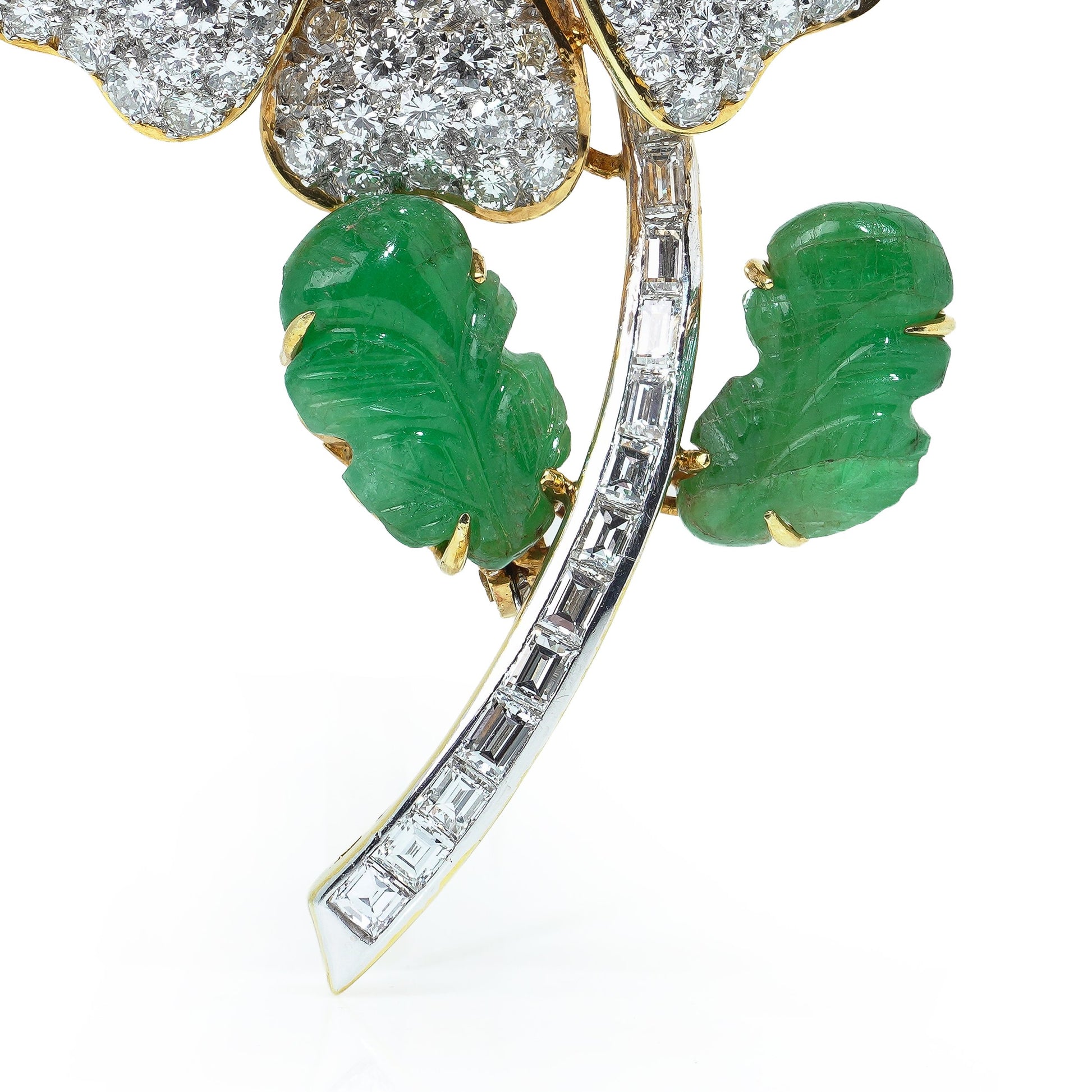 A flower brooch set with diamonds, a pearl centre and emerald leaves, in yellow and white gold