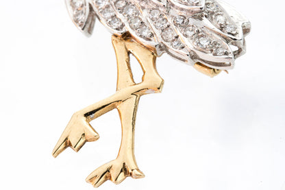 Vintage 18kt yellow gold stork brooch with diamonds