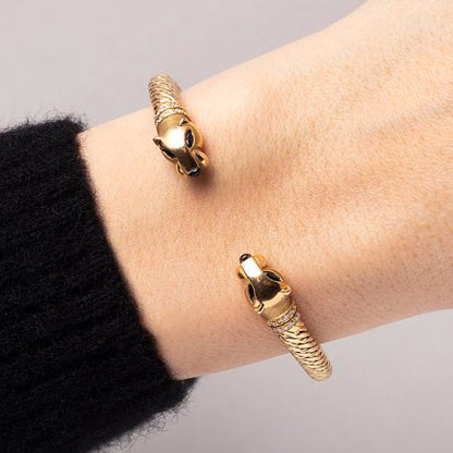 Vintage Cartier Panthere Gold Bangle Bracelet, 18ct yellow gold bangle bracelet with a panther head at both ends with sapphire eyes, onyx noses and diamond-set collars