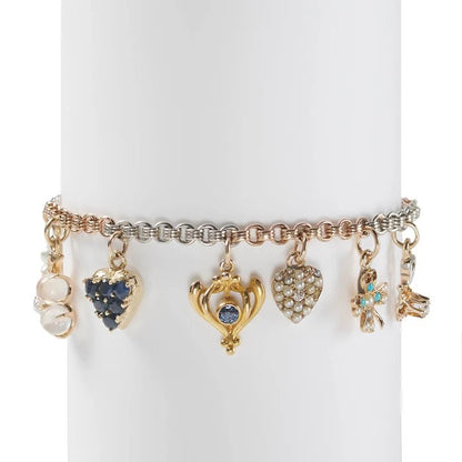 Vintage Multi Gemstone Enamel Gold Platinum Charm Bracelet, bi-colour rose gold and platinum chain suspend charms set with diamond, pearl, moonstone, sapphire, turquoise and enamel