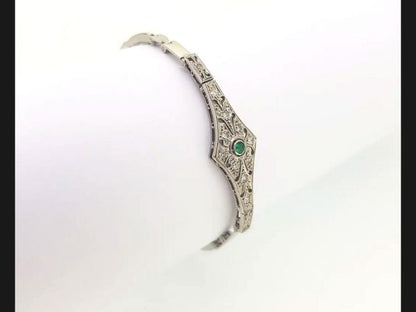 Vintage Emerald and Diamond Bracelet reminiscent of the Art Deco style; Diamond bracelet with central round cut emerald, on an expandable strap