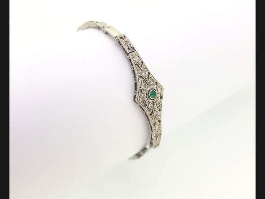 Vintage Emerald and Diamond Bracelet reminiscent of the Art Deco style; Diamond bracelet with central round cut emerald, on an expandable strap