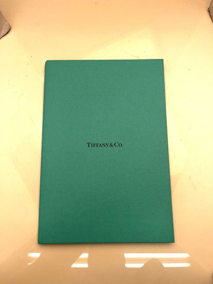 Tiffany & Co platinum diamond halo ring.