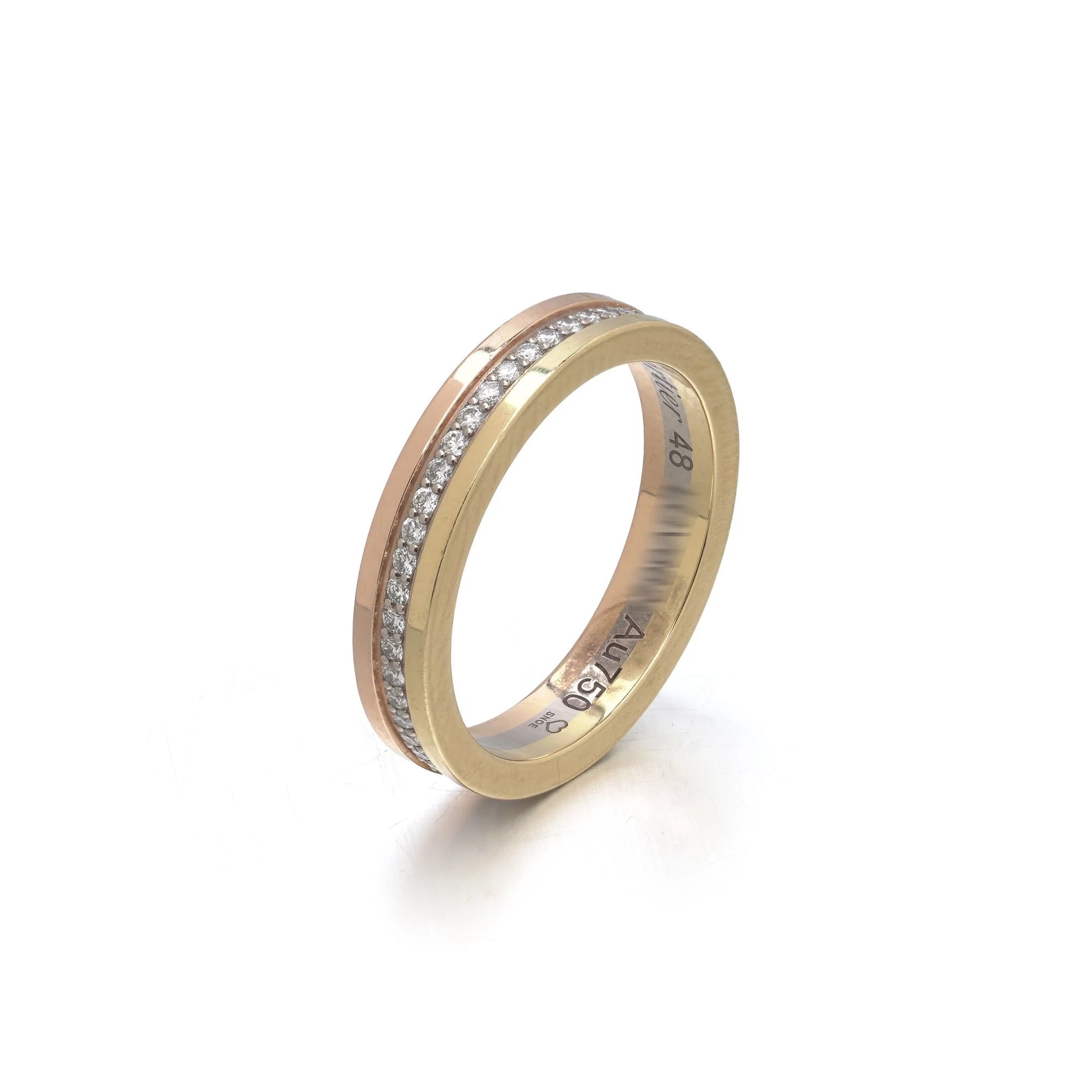 A diamond band in yellow, rose and white gold, stamped Au750