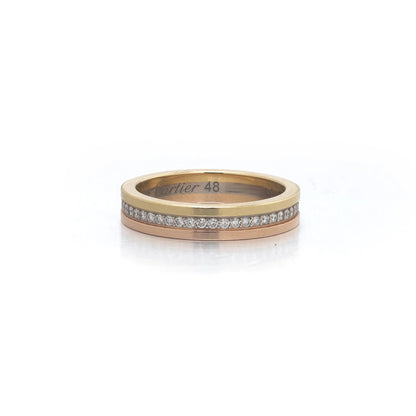 A diamond band in yellow, rose and white gold, stamped Cartier