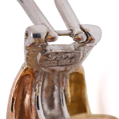 Close-up of an 18Kt ITALY stamp on a gold earring