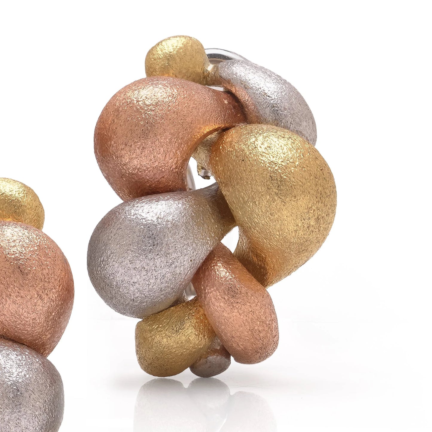 A pair of textured yellow, rose and white gold pebble design earrings